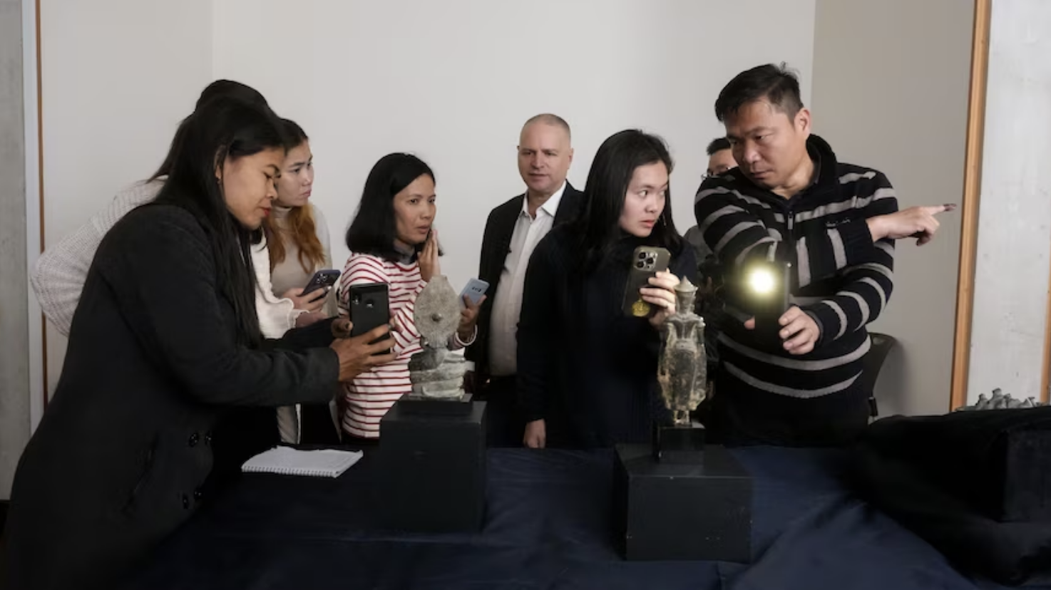 Eden Bridge legal team and experts inspecting looted Cambodian artifacts during cultural heritage repatriation efforts